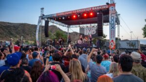 Concert goers rocking out to a band playing on stage