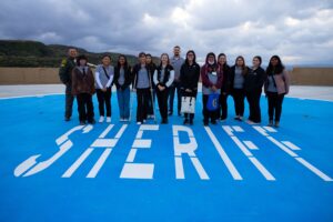 Photo of Youth in Government participants at the sheriff's station helipad.