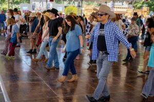 Group of people line dancing