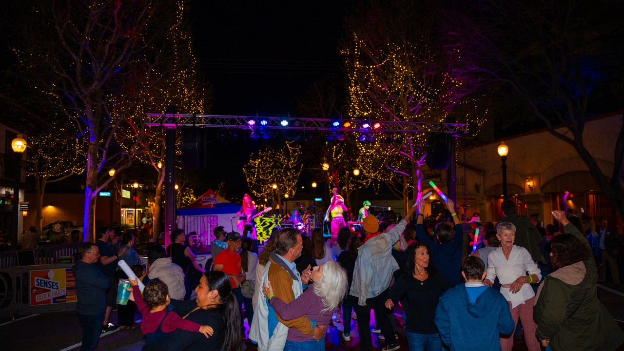 Group dancing to live music at SENSES Block Party