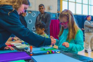 Young kids crafting at a table