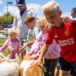Kids Petting Goats