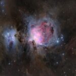 Painting of a galaxy with black, blues and purples