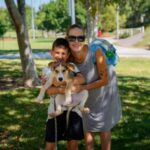 A mother and son with their newly adopted dog