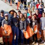 Group of smiling volunteers at the River Rally event