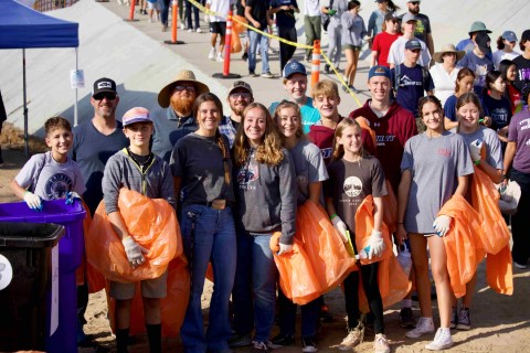 Group of smiling volunteers at the River Rally event