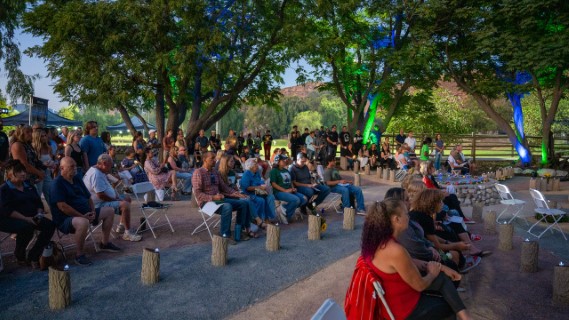 Attendees sitting around the pillars at Central Park