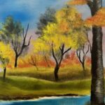 Beautiful landscape with orange, yellow and green trees and a beautiful river flowing through