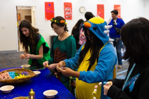 Teens dressed up doing crafts