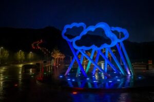 When a Cloud Met Cloud Public Art piece at Central Park and River of Lights behind it. The River of Lights Holiday Light Show will take place at Central Park from dusk until 10:00 p.m. through New Year's Eve.