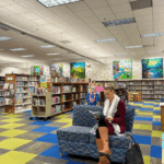 Woman sitting reading a book in the Valencia Library Children's Area. The City of Santa Clarita is inviting artists to submit proposals for a new, large-scale art installation to be displayed above the children’s area at the Santa Clarita Public Library Valencia Branch (23743 Valencia Boulevard). The selected works will be on view for two years, from May 18, 2026 through May 23, 2028. For more information or questions about this opportunity, please visit SantaClaritaArts.com or contact Garrett Fagan at ArtistCall@santa-clarita.com.