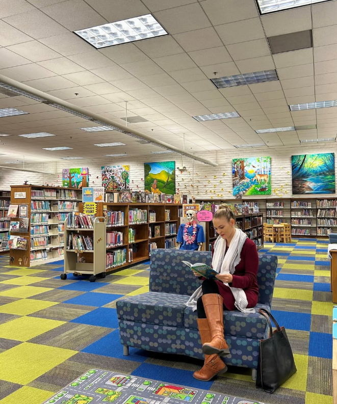Woman sitting reading a book in the Valencia Library Children's Area. The City of Santa Clarita is inviting artists to submit proposals for a new, large-scale art installation to be displayed above the children’s area at the Santa Clarita Public Library Valencia Branch (23743 Valencia Boulevard). The selected works will be on view for two years, from May 18, 2026 through May 23, 2028. For more information or questions about this opportunity, please visit SantaClaritaArts.com or contact Garrett Fagan at ArtistCall@santa-clarita.com.