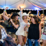 Woman dancing on the Honky Tonk dance floor at the Santa Clarita Cowboy Festival.