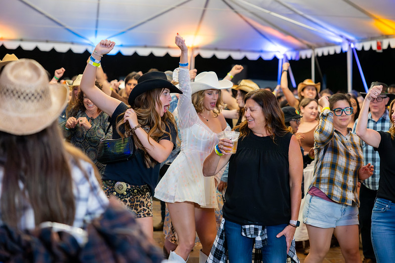 Woman dancing on the Honky Tonk dance floor at the Santa Clarita Cowboy Festival.