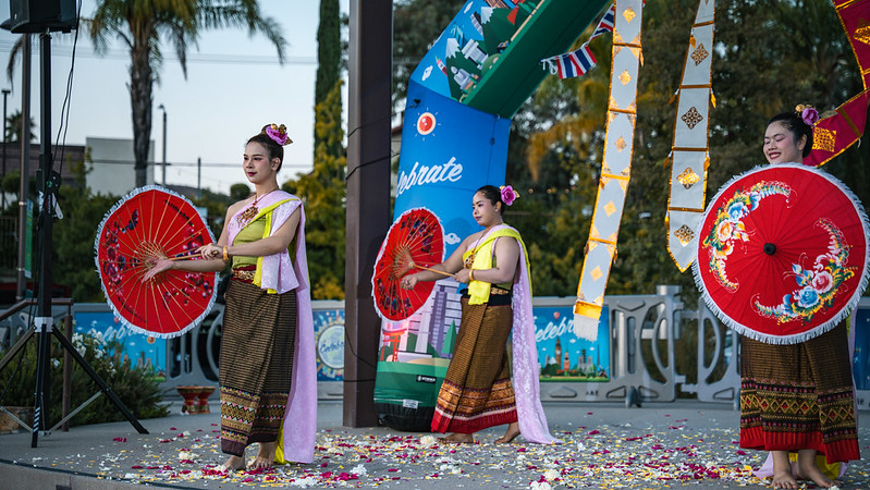 Celebrate Thailand Performers with Umbrellas on Stage