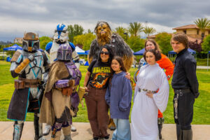 Star Wars characters posing with a mother and child.