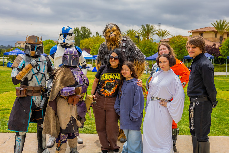 Star Wars characters posing with a mother and child.